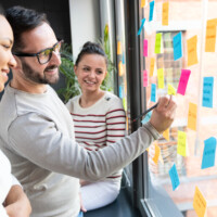 Business people meeting at office and use post it notes