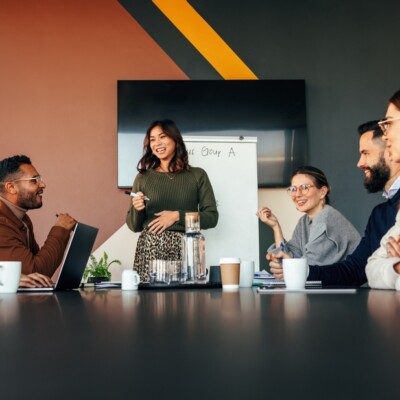 Businesswoman presenting her business strategy to her colleagues