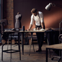 Handsome serious tailor
