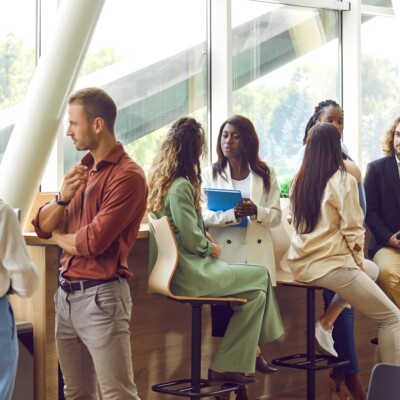 Business professionals communicating at a conference