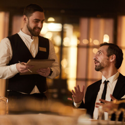 Man ordering food in luxury restaurant