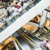 People in motion in escalators at the modern shopping mall