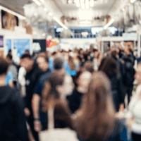 Abstract blurred people at exhibition hall of expo event trade show. Business convention show or job fair. Business concept background.