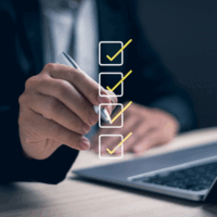 Concept of assessment, questionnaire, performance, business checklist with digital form, businessman holding pen uses laptop to take online survey, fill out form and take online exam.