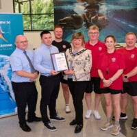 Staff from Dungannon Leisure Centre receiving a certificate