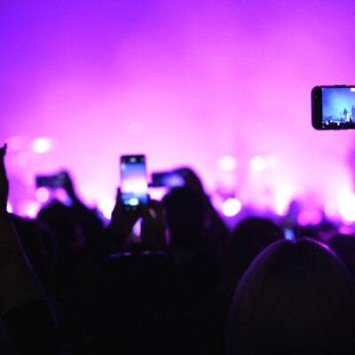 Lot fun people record music video use mobile phone. Fan crowd shoot k pop live concert. Many men hang out cool rave fest. Joy group chill night club hall. Dj star raise hand up. Make neon light photo.