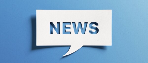 News text for newsletter, latest news, breaking news, blog website. Cut out paper speech bubble on blue background for banner, headline background. Communication on current events.